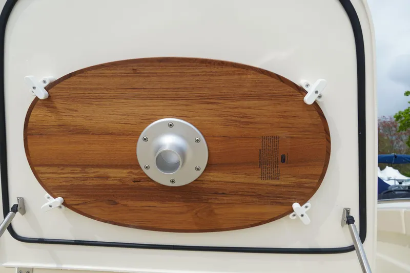 Slide: The Image of 2026 Scout 288 LXF boat with wooden panel detail and metal fixture. - 43