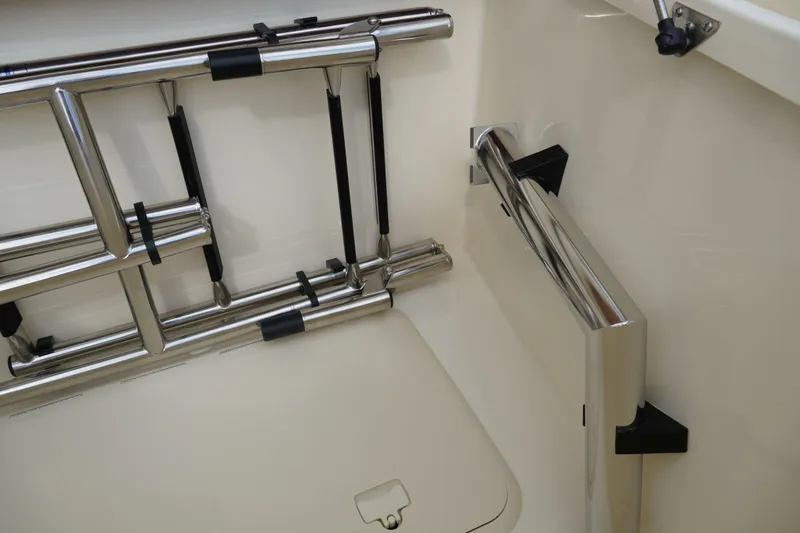 Slide: The Image of 2026 Scout 288 LXF boat ladder and storage compartment detail. - 44
