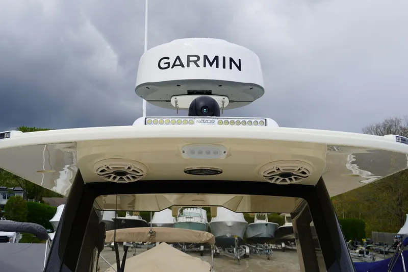 Slide: The Image of 2026 Scout 288 LXF boat with Garmin radar and speakers on the roof. - 46