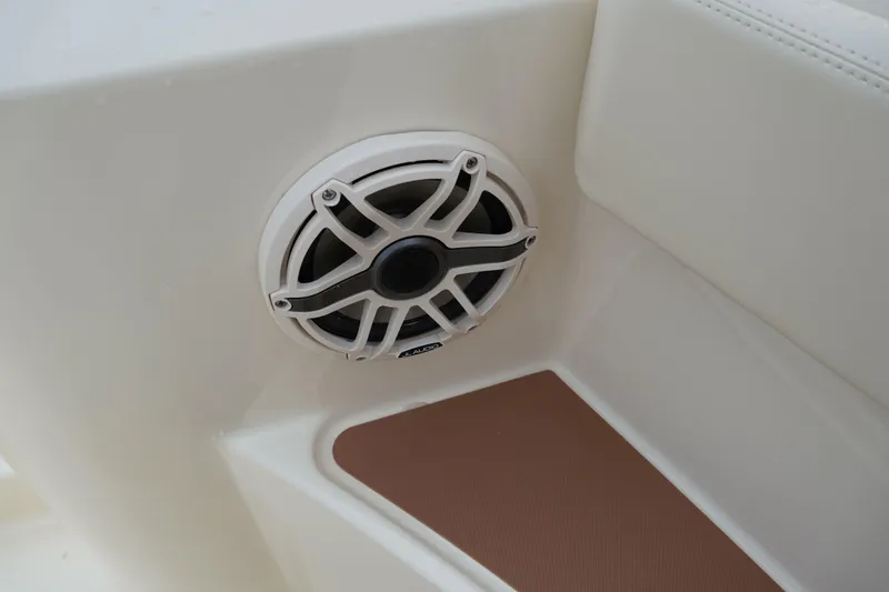 Slide: The Image of 2026 Scout 288 LXF boat speaker detail, featuring a white marine audio system. - 47