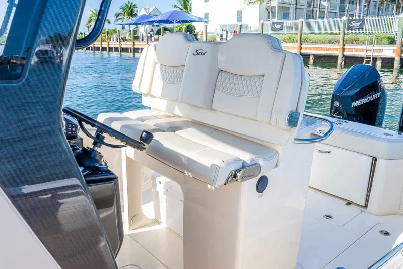 Slide: The Image of Manufacturer Provided Image: 2026 Scout 288 LXF boat interior with luxurious seating and Mercury engine. - 5