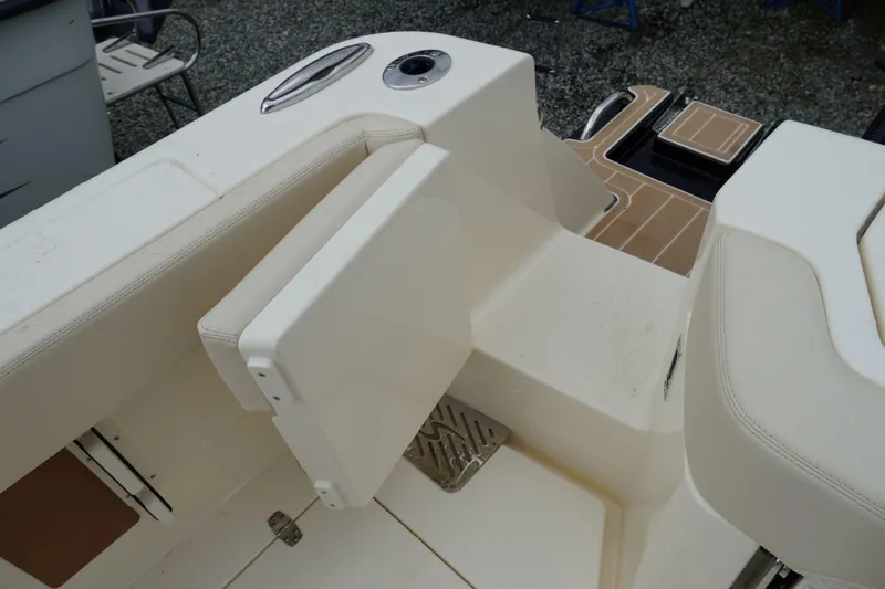 Slide: The Image of Interior view of 2026 Scout 288 LXF boat, featuring seating and deck details. - 63