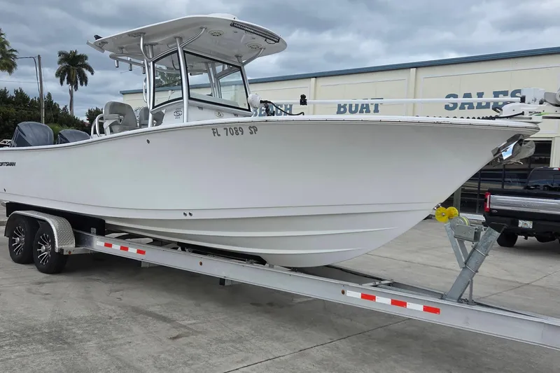 Slide: The Image of 2020 Sportsman Open 282 Center Console boat on trailer at dealership. - 1