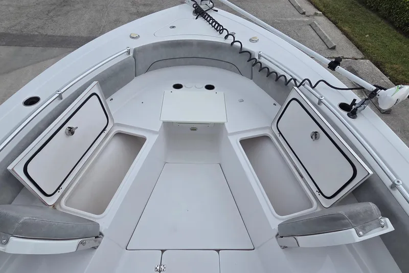 Slide: The Image of 2020 Sportsman Open 282 Center Console boat with open storage compartments. - 12