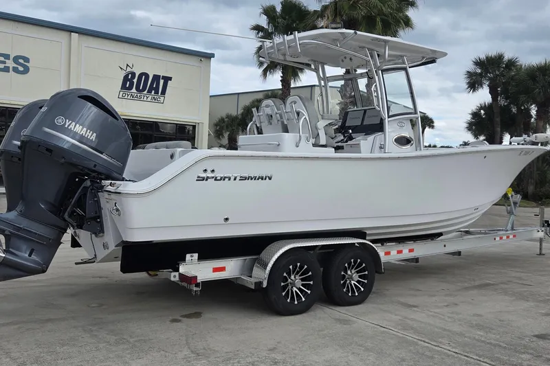 Slide: The Image of 2020 Sportsman Open 282 Center Console boat on trailer, featuring Yamaha engine. - 2