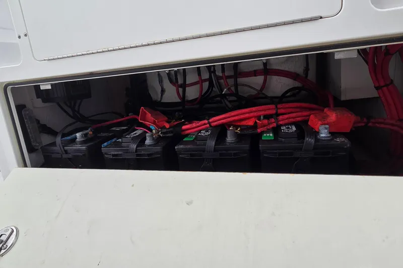Slide: The Image of Batteries and wiring inside a 2020 Sportsman Open 282 Center Console boat. - 6