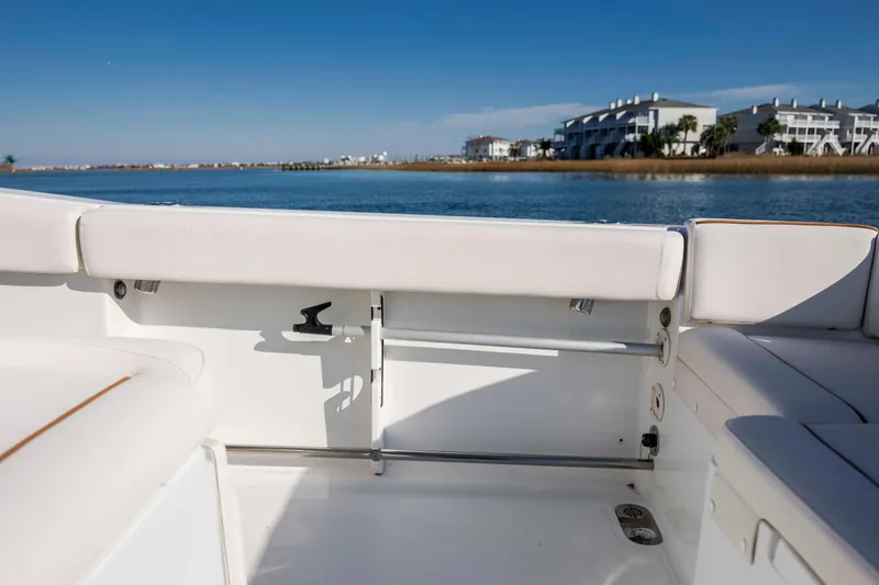 Slide: The Image of 2022 Sea Hunt Ultra 265 SE boat interior with waterfront view. - 25