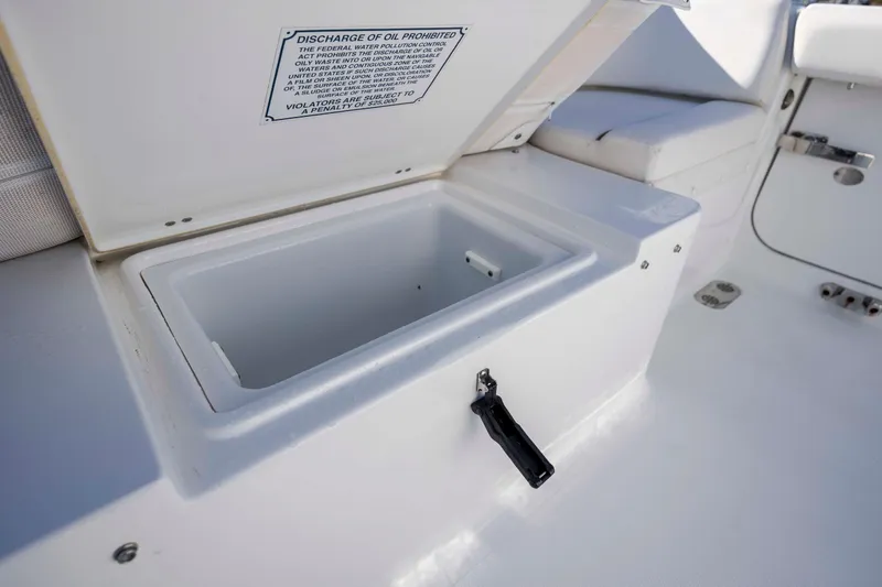 Slide: The Image of Open storage compartment on 2022 Sea Hunt Ultra 265 SE boat deck. - 28