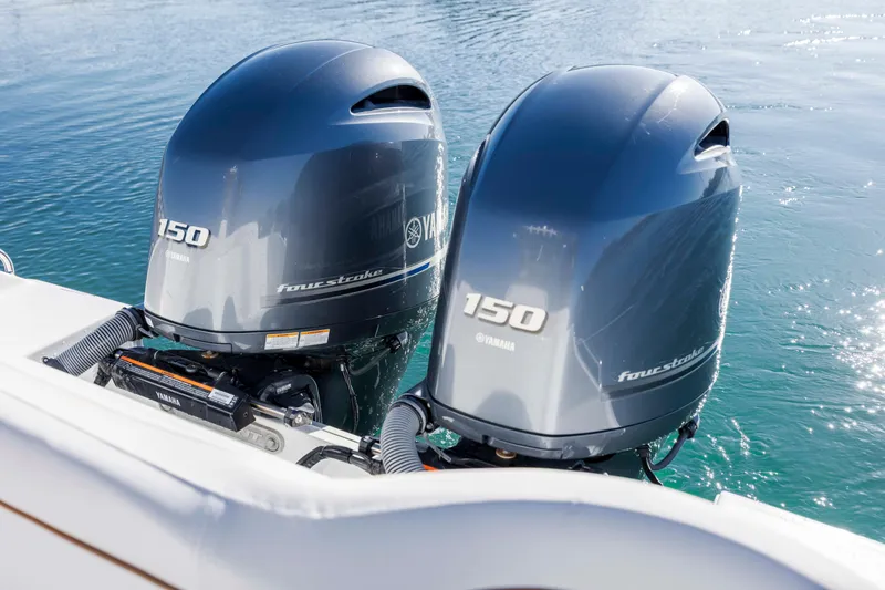 Slide: The Image of Twin Yamaha 150 four-stroke engines on 2022 Sea Hunt Ultra 265 SE boat. - 29