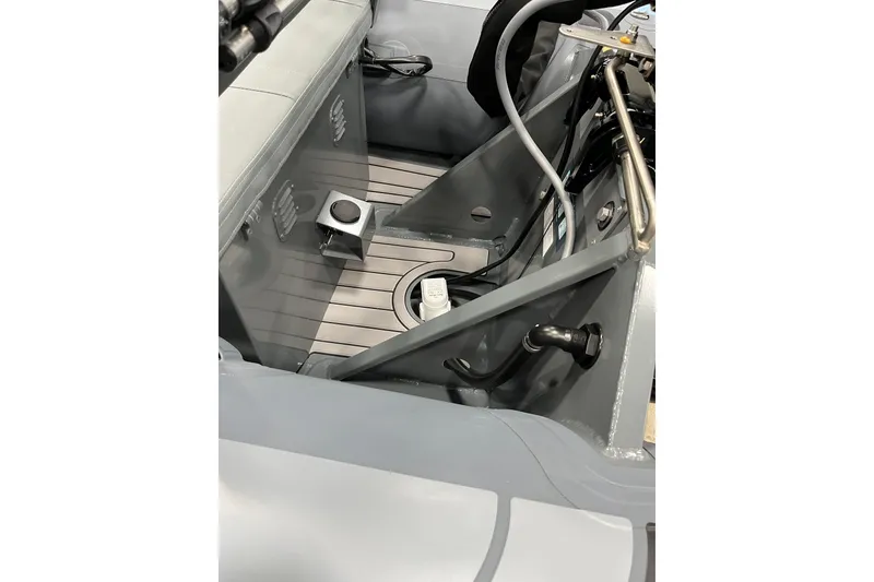 Slide: The Image of Interior view of 2026 Highfield Classic 360 FCT boat, showcasing seating and controls. - 6