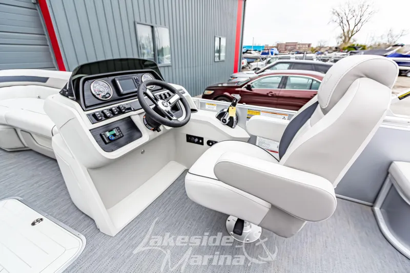 Slide: The Image of 2026 Godfrey Sweetwater 2286 SFLC boat interior with modern helm and comfortable seating. - 10