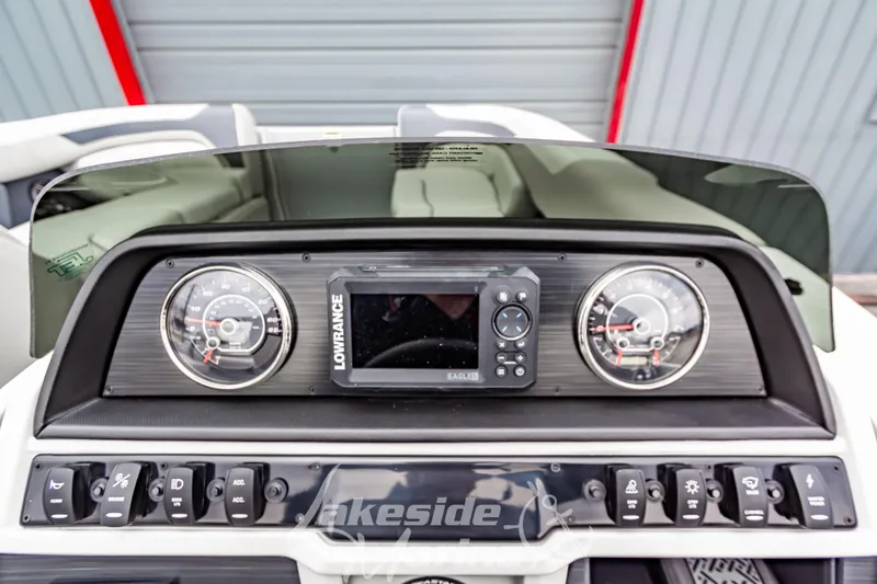 Slide: The Image of Dashboard of 2026 Godfrey Sweetwater 2286 SFLC with gauges and Lowrance display. - 11