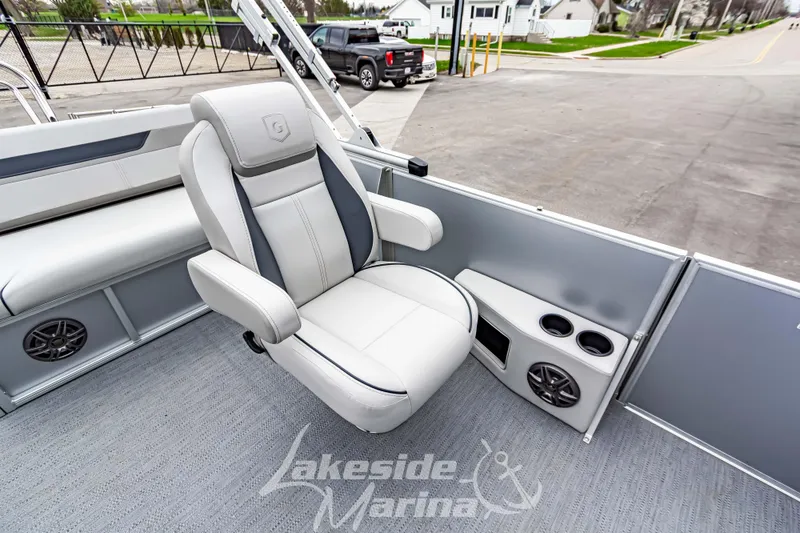 Slide: The Image of 2026 Godfrey Sweetwater 2286 SFLC boat interior with plush seating and cup holders. - 13