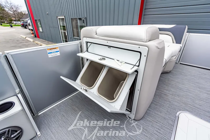 Slide: The Image of 2026 Godfrey Sweetwater 2286 SFLC boat with open storage compartments on deck. - 14