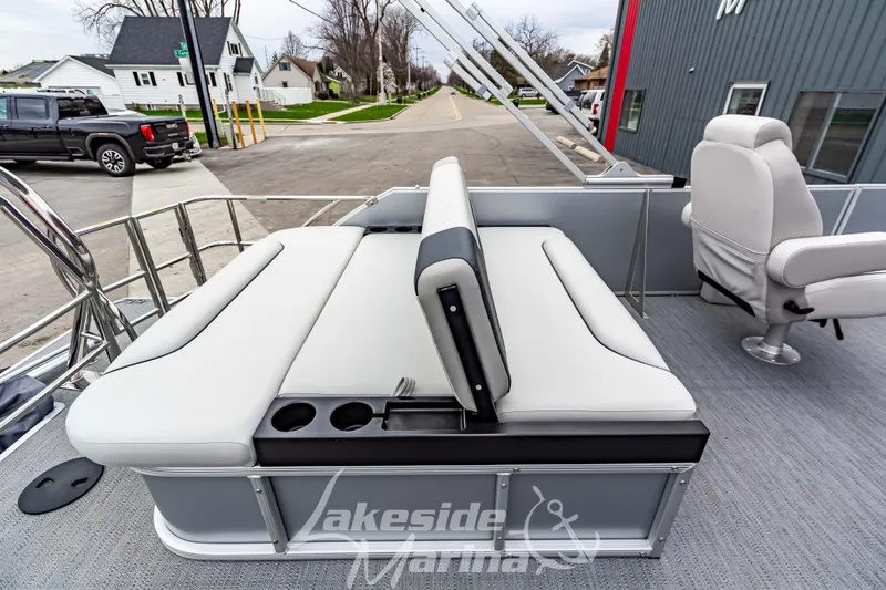 Slide: The Image of 2026 Godfrey Sweetwater 2286 SFLC pontoon boat interior with seating and cup holders. - 18