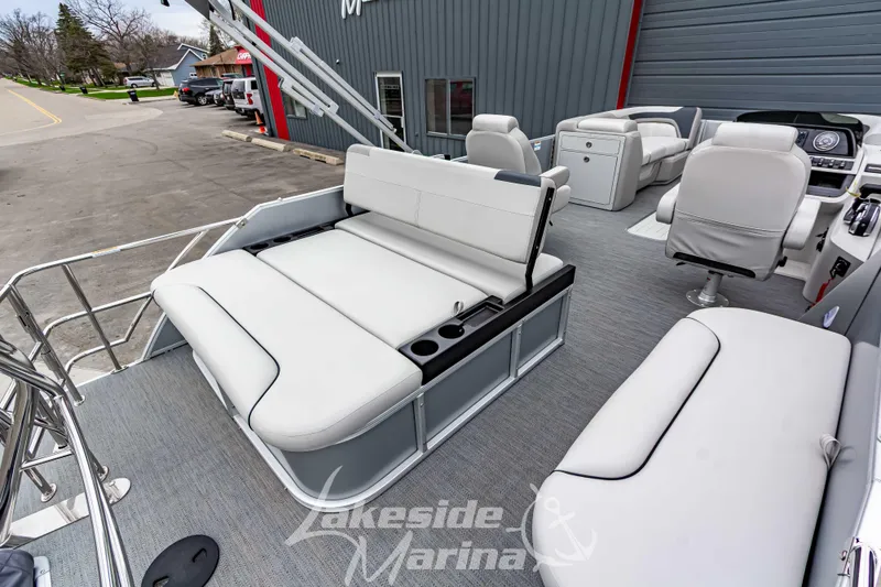 Slide: The Image of 2026 Godfrey Sweetwater 2286 SFLC pontoon boat interior with plush seating and modern design. - 20