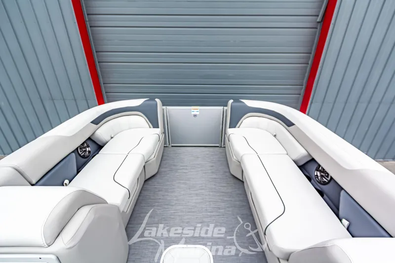 Slide: The Image of 2026 Godfrey Sweetwater 2286 SFLC pontoon boat interior with plush seating and modern design. - 5