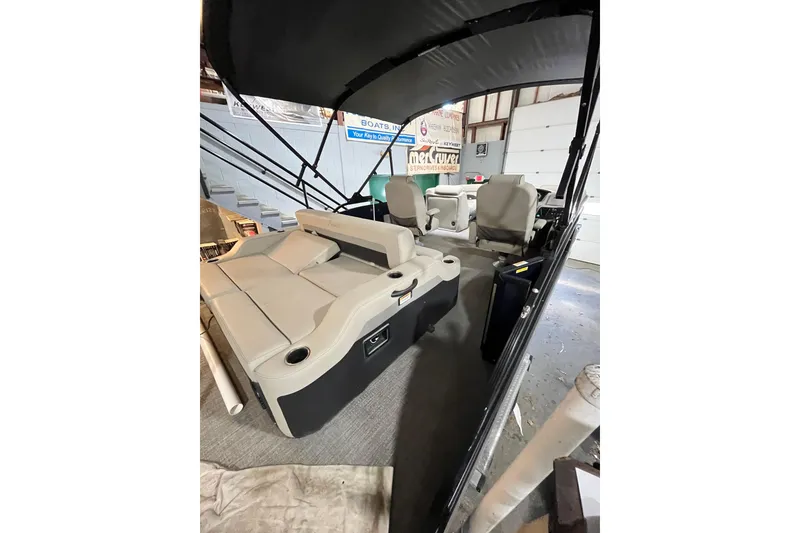 Slide: The Image of 2021 Barletta Cabrio 20UC pontoon boat interior with seating and canopy. - 12