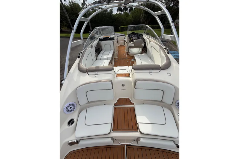 Slide: The Image of 2014 Yamaha Boats 242 Limited interior with spacious seating and sleek design. - 11