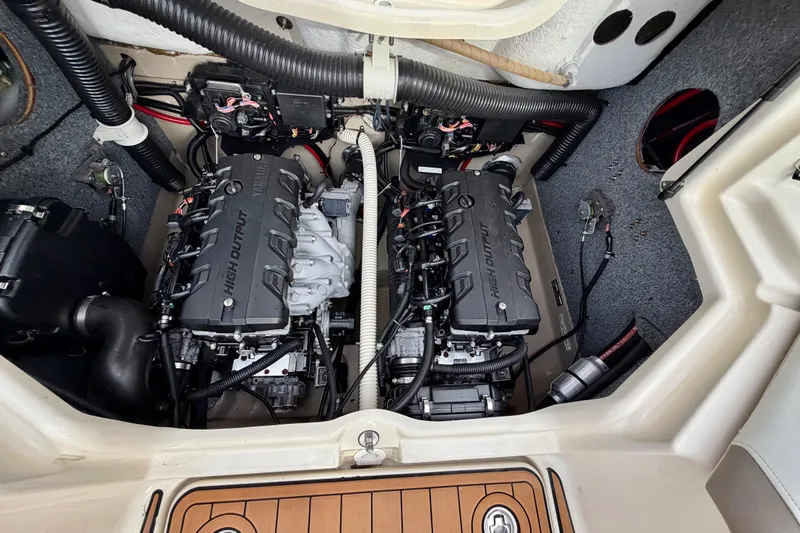 Slide: The Image of Engine compartment of a 2014 Yamaha Boats 242 Limited, featuring dual high-output engines. - 12