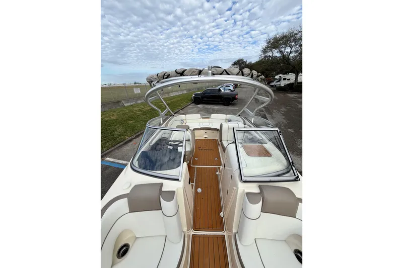 Slide: The Image of 2014 Yamaha Boats 242 Limited interior with seating and deck view. - 13