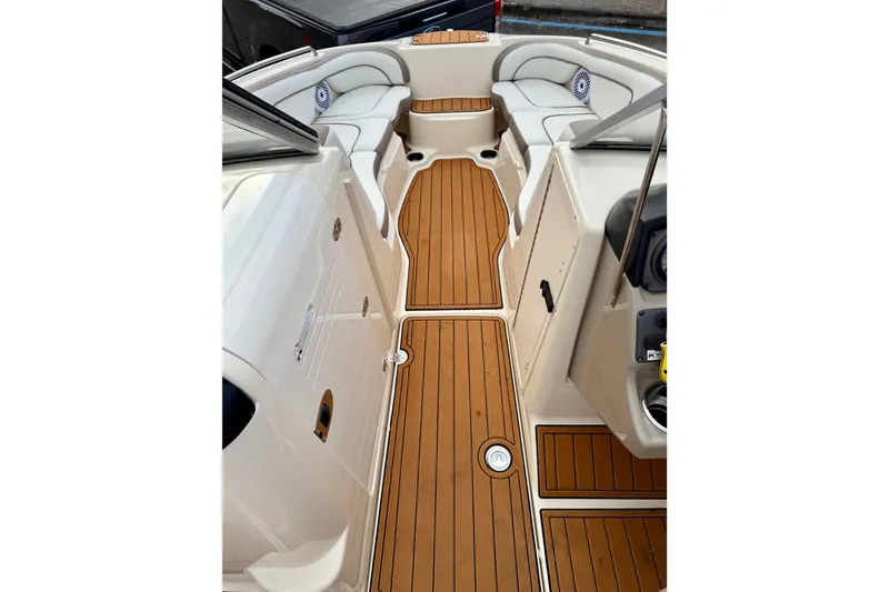 Slide: The Image of 2014 Yamaha Boats 242 Limited interior with teak flooring and cushioned seating. - 20