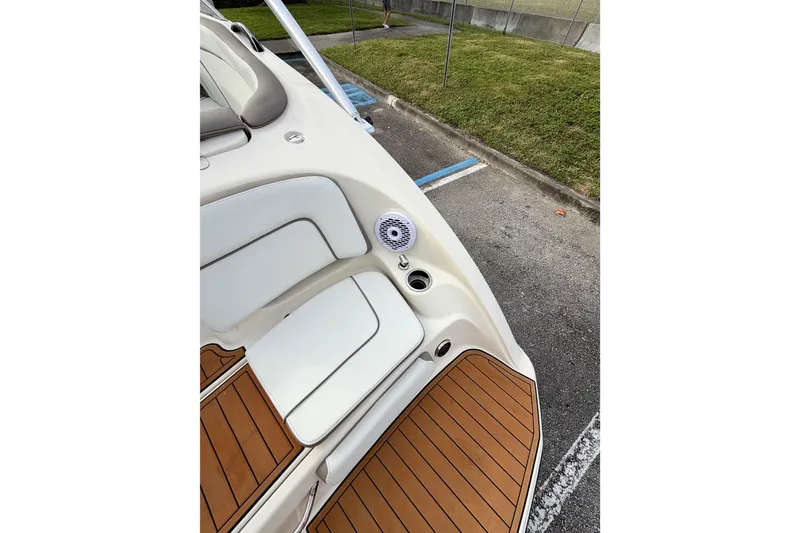 Slide: The Image of 2014 Yamaha Boats 242 Limited, featuring sleek seating and teak-style flooring. - 9