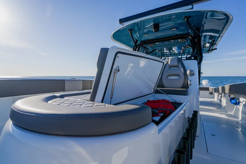 Slide: The Image of 2025 Freeman 42LR boat interior with open storage compartment, ocean view. - 13
