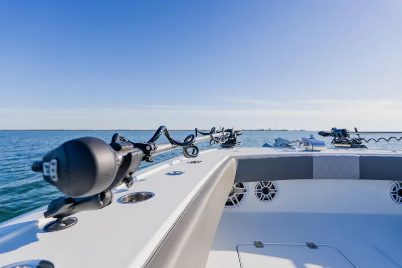 Slide: The Image of Freeman 42LR 2025 boat on open water, showcasing sleek design and fishing equipment. - 14