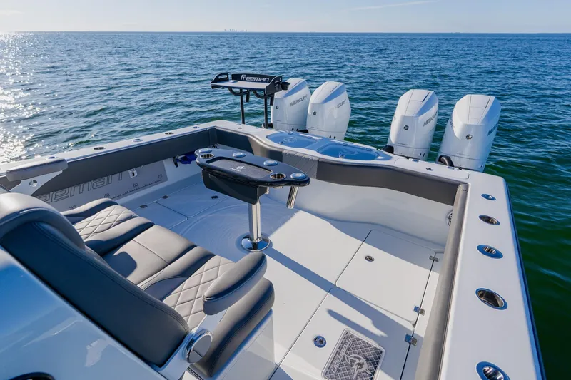 Slide: The Image of Luxury Freeman 42LR boat, 2025 model, with sleek seating and powerful engines on open water. - 20