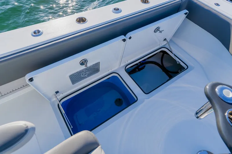 Slide: The Image of Freeman 42LR 2025 boat with open storage compartments on deck. - 24