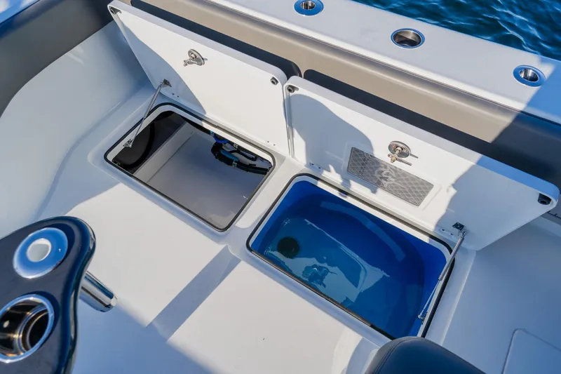 Slide: The Image of Freeman 42LR 2025 boat storage compartments with open hatches, showcasing interior features. - 25