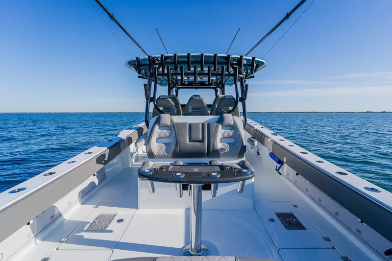Slide: The Image of Freeman 42LR 2025 boat interior with seating, ocean view, and clear blue sky. - 26