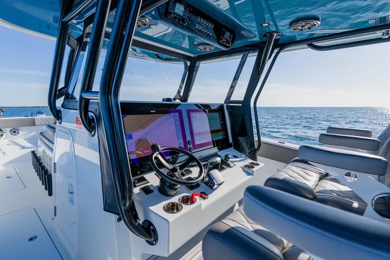 Slide: The Image of Interior of 2025 Freeman 42LR boat with advanced navigation system and luxurious seating. - 30