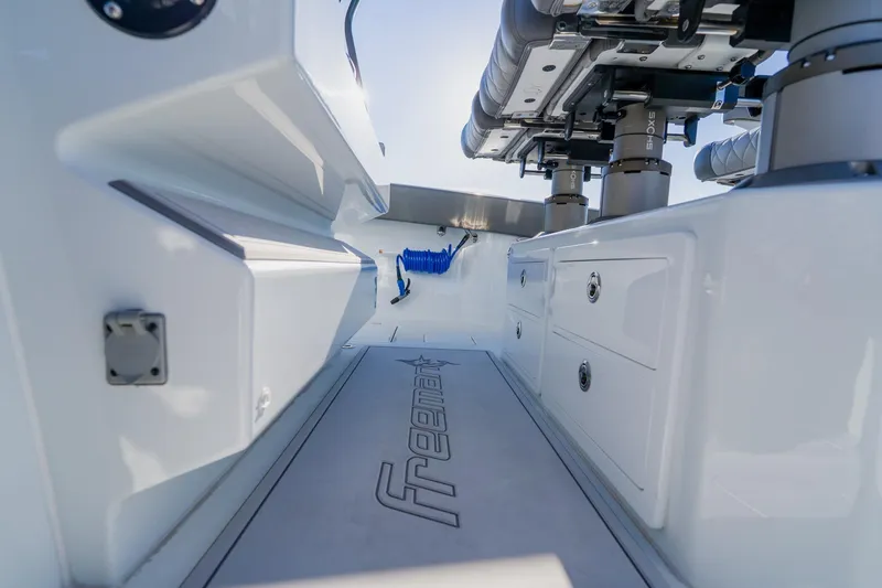 Slide: The Image of 2025 Freeman 42LR boat interior with sleek design and storage compartments. - 36