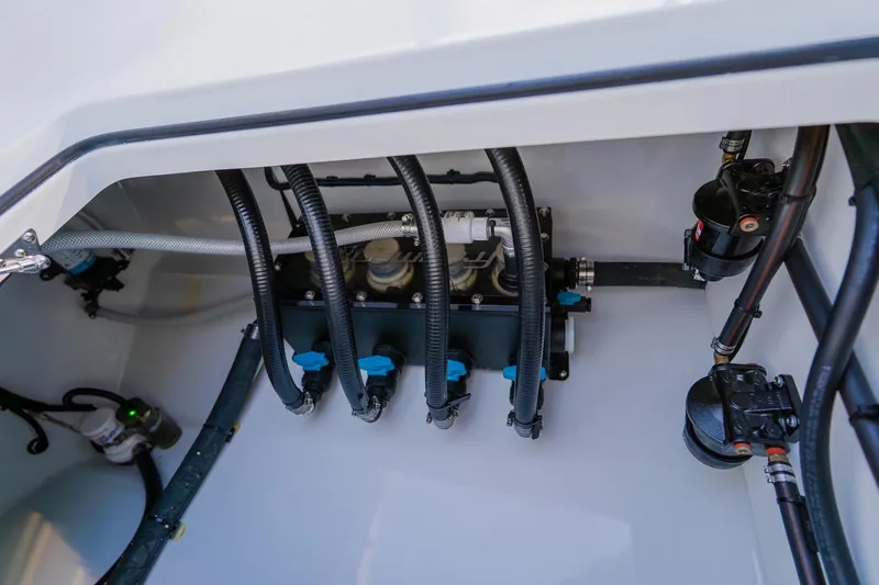 Slide: The Image of Freeman 42LR 2025 boat engine compartment with hoses and mechanical components. - 39