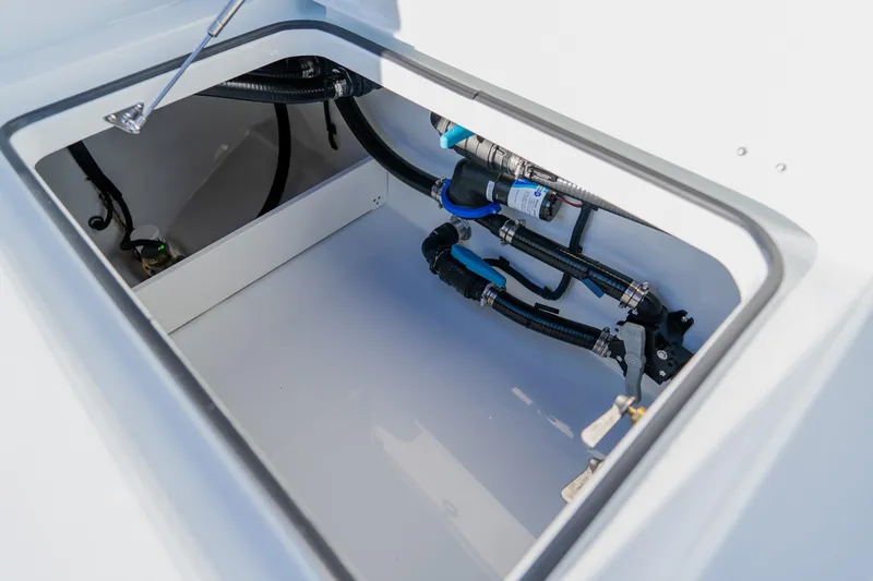 Slide: The Image of Open compartment of 2025 Freeman 42LR boat showing internal plumbing and wiring. - 41