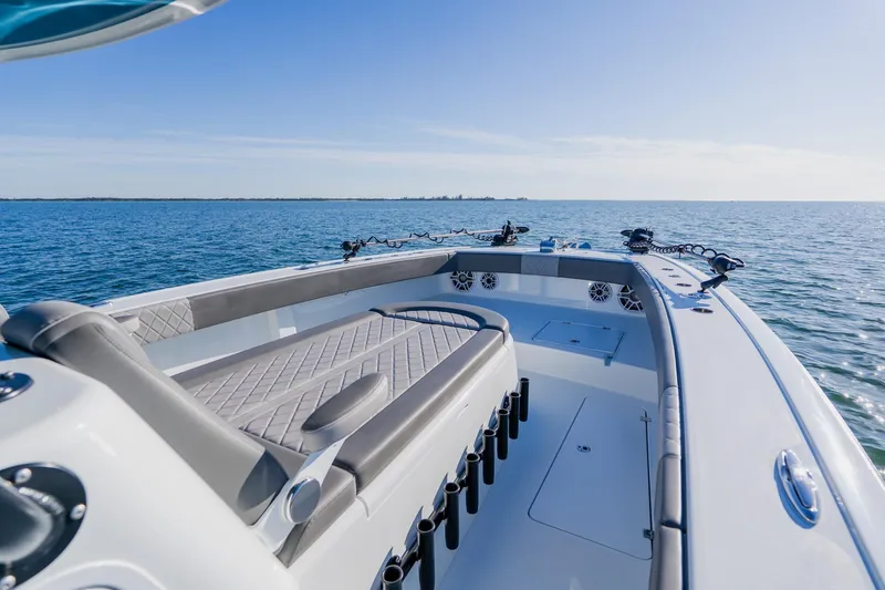 Slide: The Image of 2025 Freeman 42LR boat on open water, showcasing sleek design and spacious deck. - 6