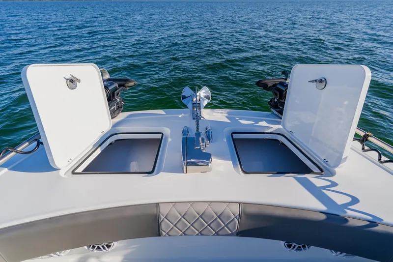 Slide: The Image of Freeman 42LR 2025 boat deck with open storage compartments on the water. - 9