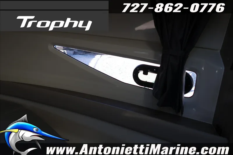 Slide: The Image of Interior view of 2026 Bayliner Trophy T29 Explorer boat with window and curtain. - 18