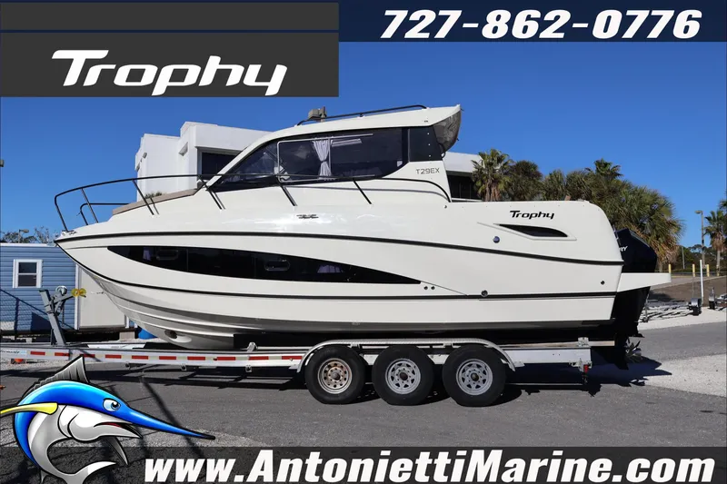 Slide: The Image of 2026 Bayliner Trophy T29 Explorer boat on trailer at Antonietti Marine dealership. - 2