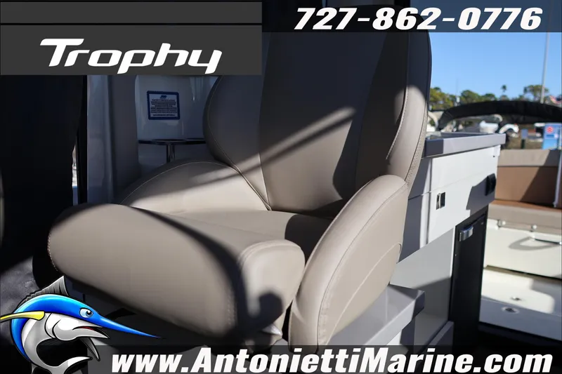 Slide: The Image of 2026 Bayliner Trophy T29 Explorer boat seat with contact details and logo. - 23