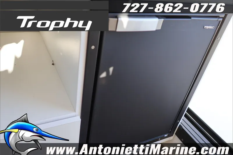 Slide: The Image of Bayliner Trophy T29 Explorer 2026 interior with fridge, contact Antonietti Marine for details. - 25