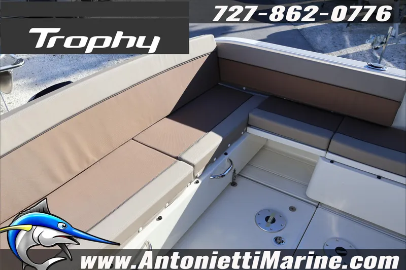 Slide: The Image of 2026 Bayliner Trophy T29 Explorer boat seating area with contact details and website. - 28