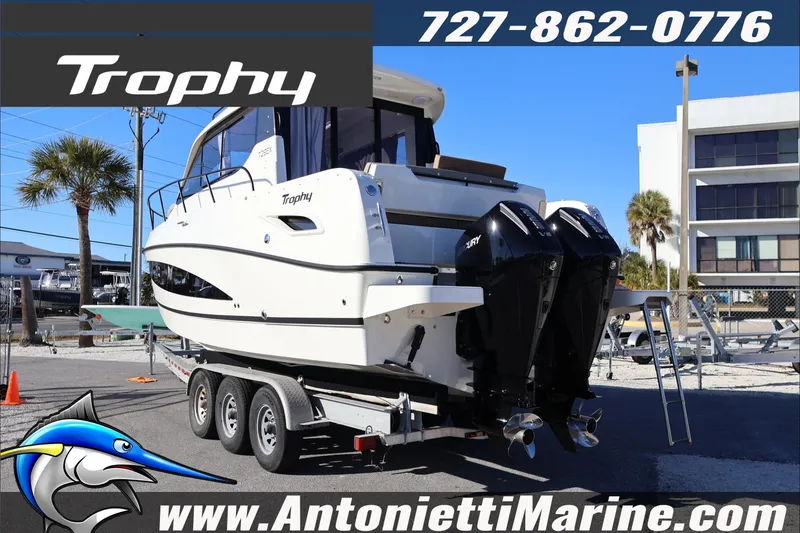 Slide: The Image of 2026 Bayliner Trophy T29 Explorer boat on trailer at Antonietti Marine dealership. - 3