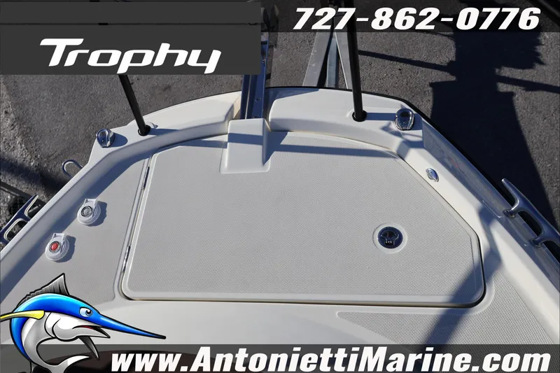 Slide: The Image of 2026 Bayliner Trophy T29 Explorer boat deck with contact details and logo. - 32