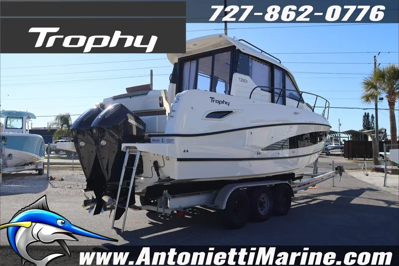 Slide: The Image of 2026 Bayliner Trophy T29 Explorer boat on trailer at Antonietti Marine dealership. - 4