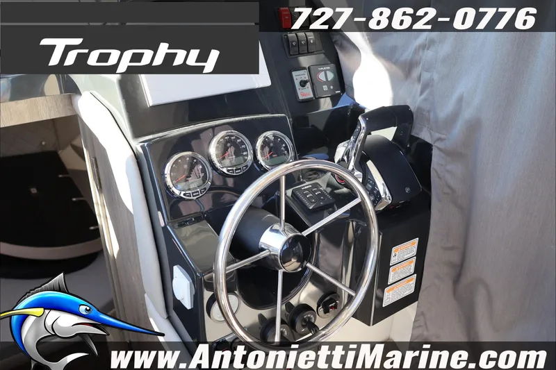 Slide: The Image of 2026 Bayliner Trophy T29 Explorer dashboard with steering wheel and controls. - 6