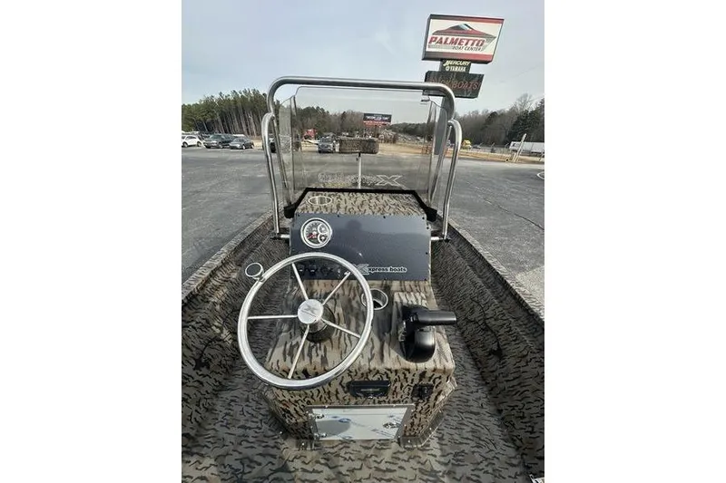 Slide: The Image of 2026 Xpress H190B Bay boat interior with steering wheel and dashboard controls. - 9