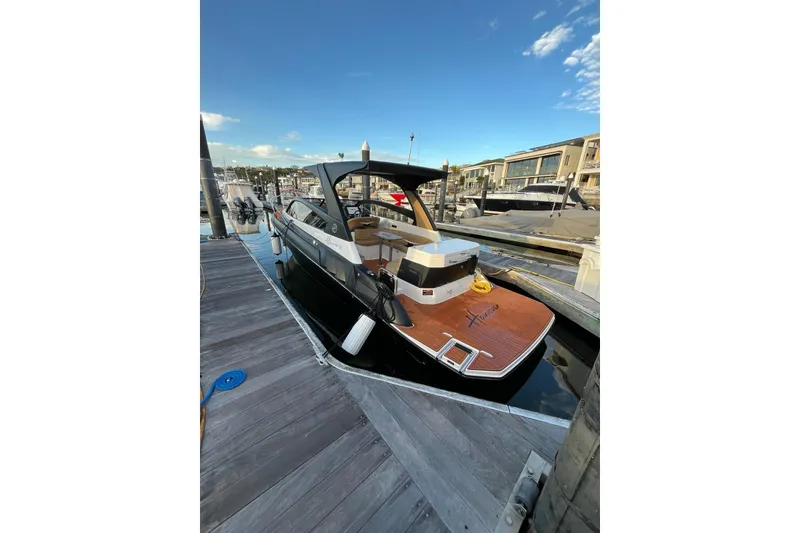 Slide: The Image of Luxury Hanover 305 yacht docked at marina, 2026 model, sunny day. - 2